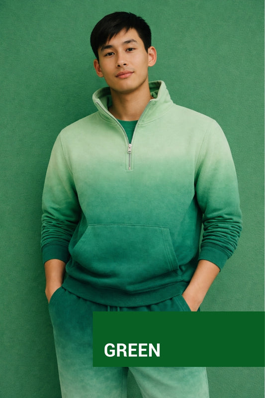 Person wearing a green half-zip sweatshirt and pants against a green background
