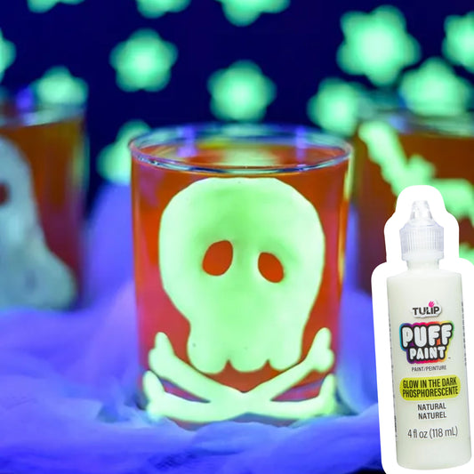 Glowing skull design on a glass with Puff Paint bottle in front