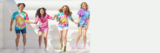 Kids wearing tie dye on the bounce house