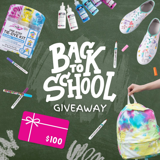 Tulip Back to School Giveaway promotion featuring a $100 gift card, tie-dye kit, dimensional fabric paints, fabric markers, a hand holding a colorful tie-dyed backpack, and custom-decorated white canvas shoes, all on a green chalkboard background.