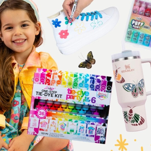 Child holding a tie-dye kit with a mug and paint products on a white background