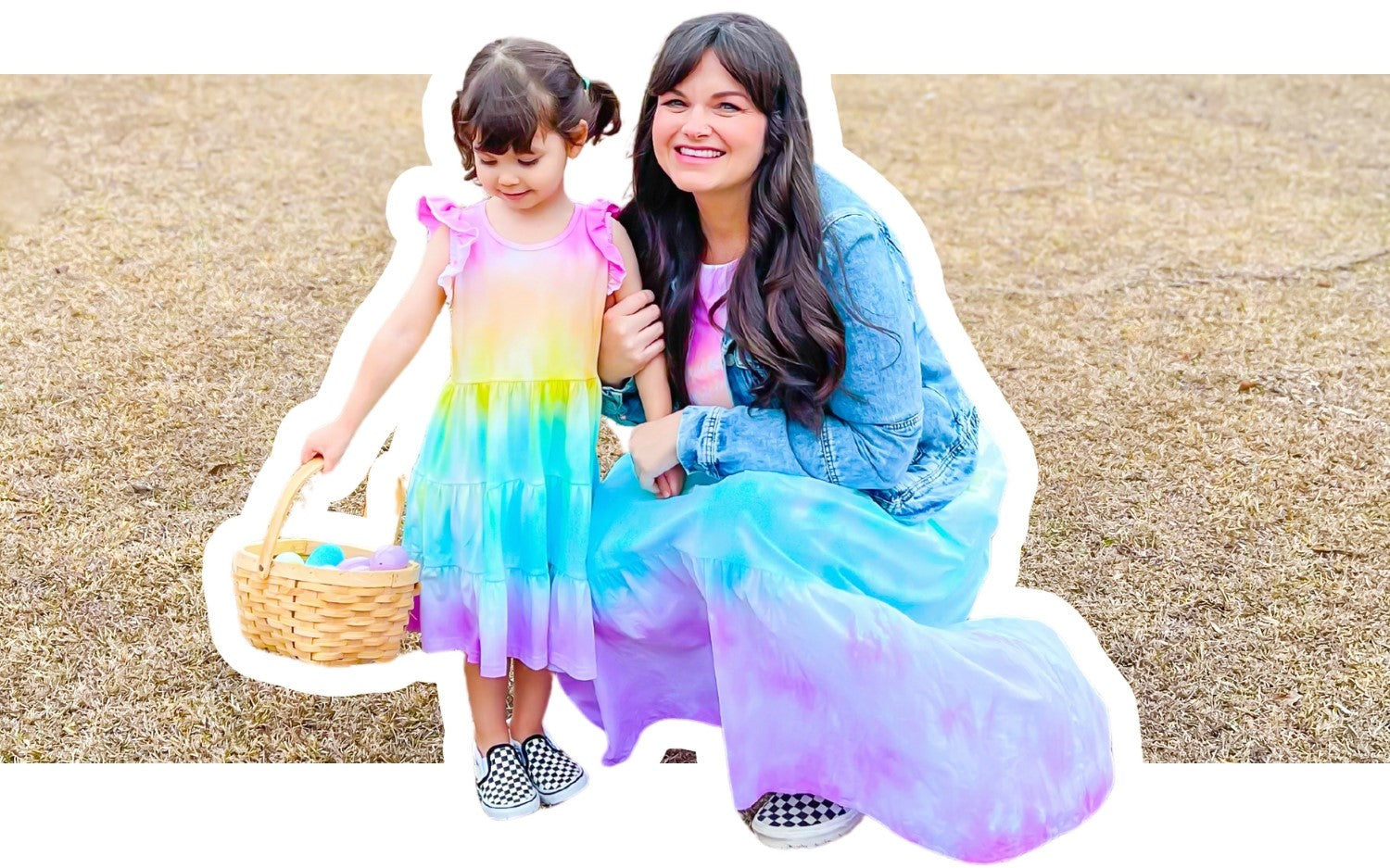 Pastel tie-dye mother and daughter Easter scene with a grass background.