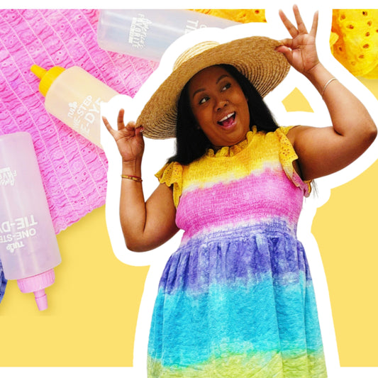 Woman in a colorful dress and straw hat posing with beach items on a yellow background