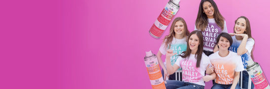Group of women holding bottles with a pink background